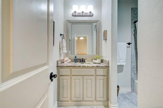 bathroom featuring a tub, vanity, and walk in shower