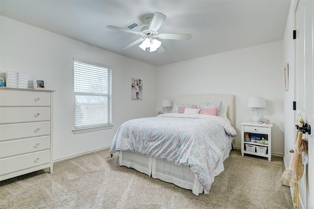 bedroom featuring carpet flooring, ceiling fan, and visible vents