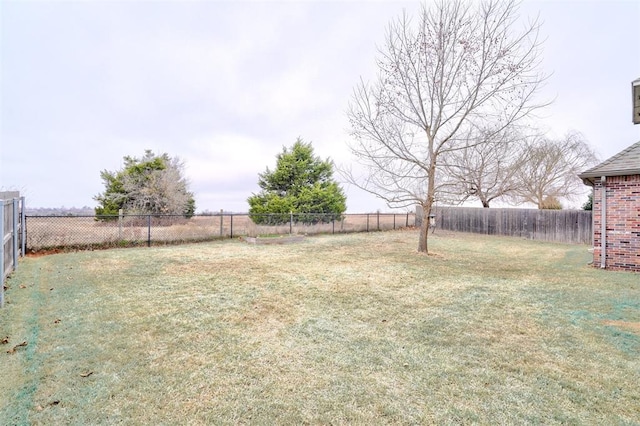 view of yard featuring a fenced backyard