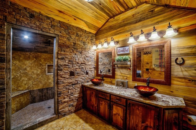 full bathroom featuring double vanity, lofted ceiling, a sink, a walk in shower, and wooden ceiling