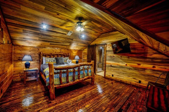 bedroom with lofted ceiling, wooden ceiling, wood walls, and hardwood / wood-style flooring