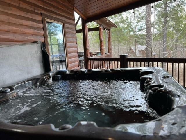 deck with a hot tub