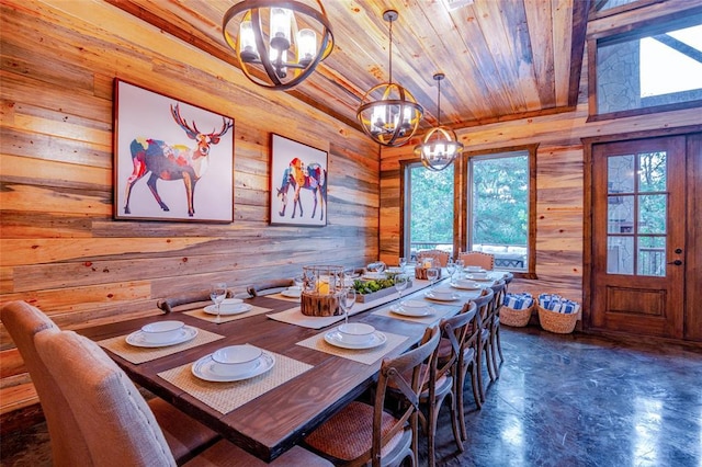 unfurnished dining area featuring wooden ceiling, an inviting chandelier, and wood walls