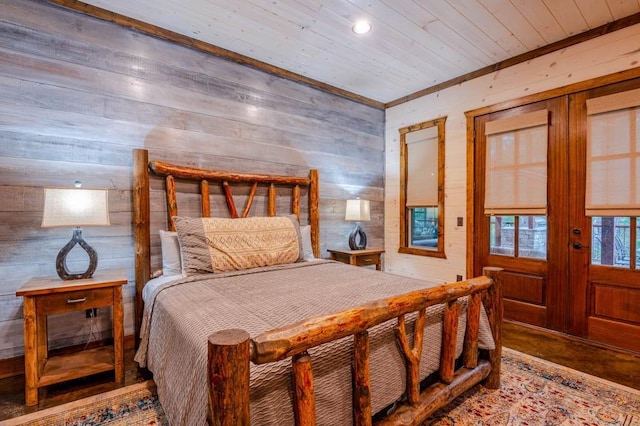 bedroom with wood walls and wooden ceiling