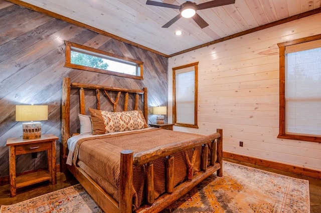 bedroom with wooden ceiling, wood walls, and wood finished floors