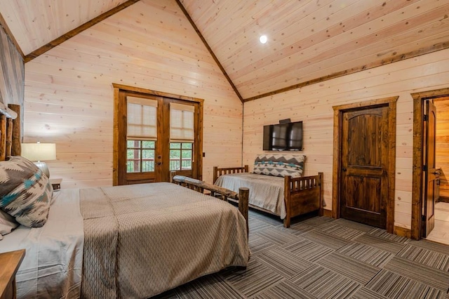 bedroom featuring wooden walls, high vaulted ceiling, dark carpet, and french doors