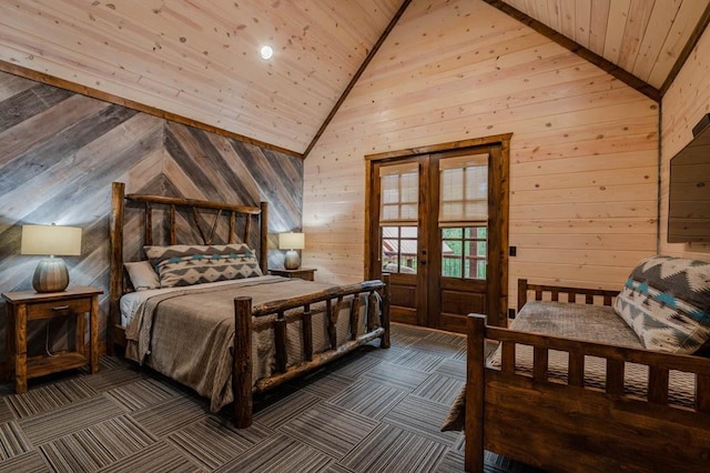 bedroom with french doors, dark carpet, wooden ceiling, and wooden walls