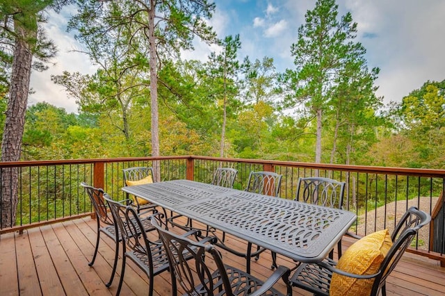 wooden deck featuring outdoor dining space