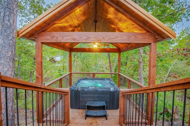 deck featuring a gazebo and a hot tub