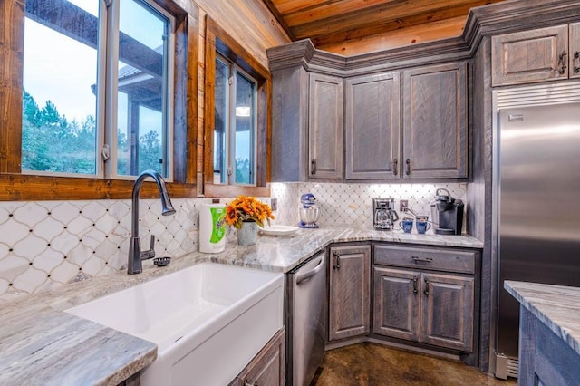 1080 N Lukfata Trail Rd, Broken Bow, OK 74728 - kitchen featuring stainless steel appliances, a sink, healthy amount of natural light, backsplash, and wood ceiling