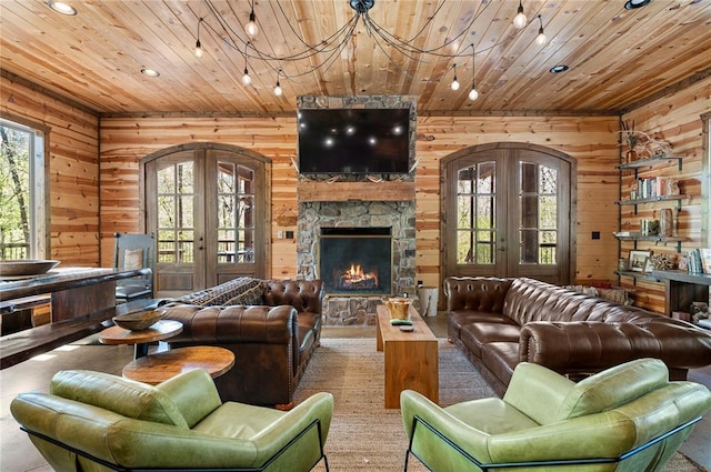 living room featuring wood ceiling, arched walkways, and french doors