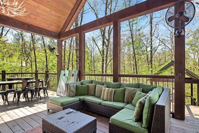 sunroom with lofted ceiling and wood ceiling