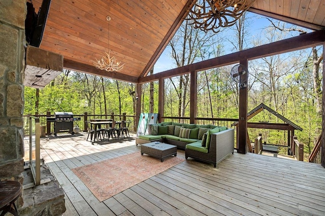 deck with outdoor dining area, area for grilling, and an outdoor living space