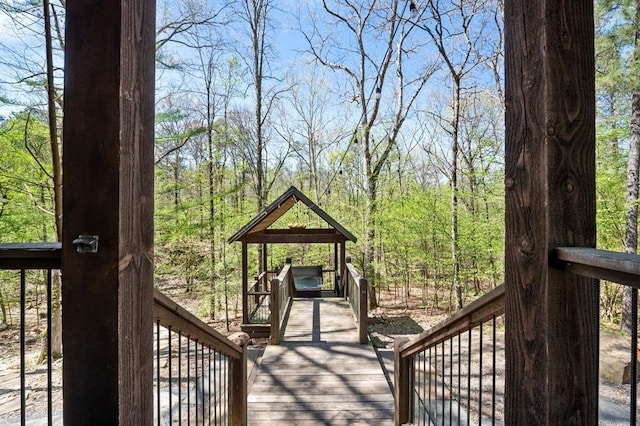 wooden deck with a forest view