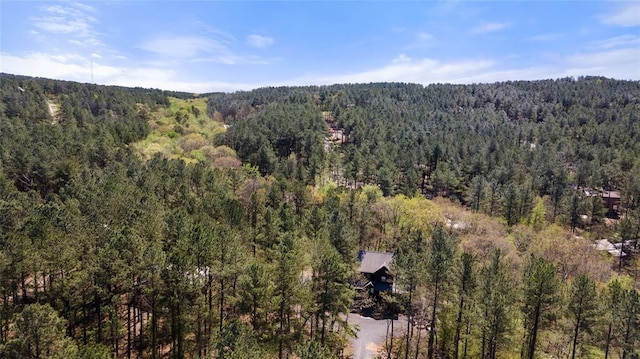 aerial view featuring a wooded view