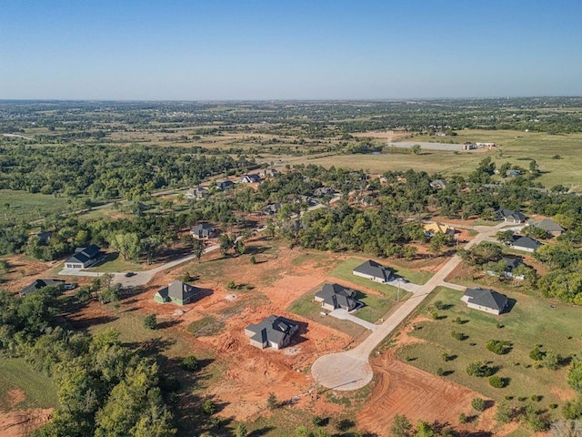 birds eye view of property with a rural view