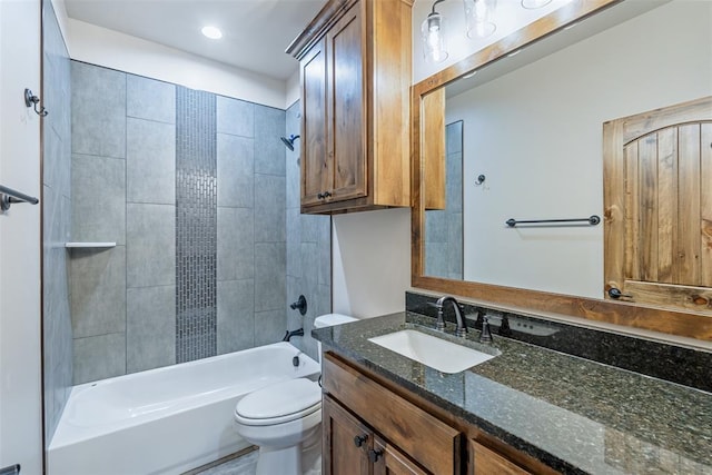 full bathroom featuring toilet, shower / bathing tub combination, and vanity