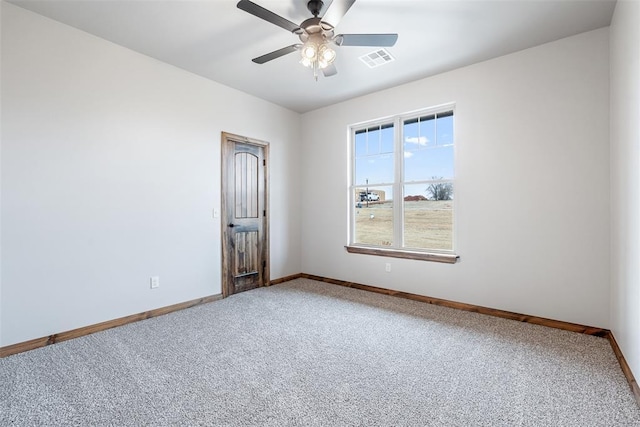 unfurnished room featuring a ceiling fan, carpet flooring, visible vents, and baseboards