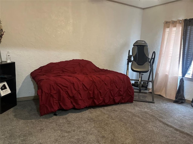 bedroom featuring carpet floors, a textured wall, and crown molding