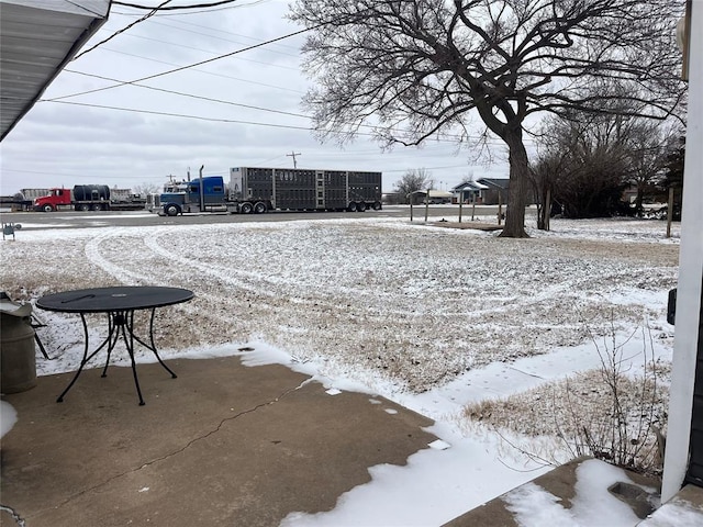 yard covered in snow with mail area