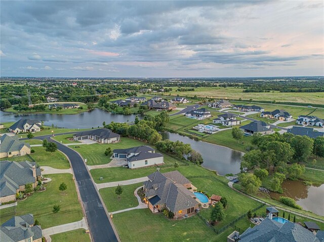 aerial view featuring a water view and a residential view