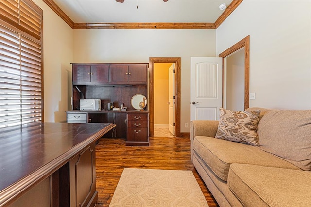 home office featuring crown molding and dark wood-type flooring