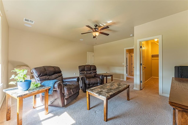 carpeted living area featuring visible vents, a ceiling fan, and baseboards