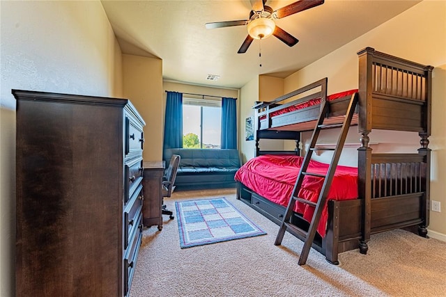 bedroom with visible vents, carpet flooring, baseboards, and ceiling fan