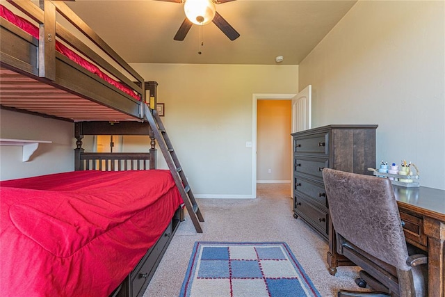 bedroom featuring baseboards and carpet