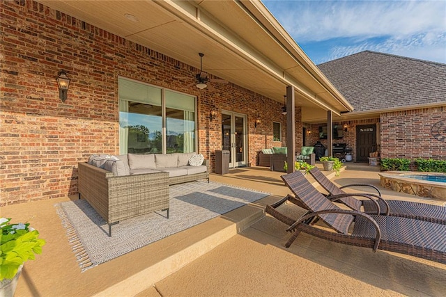 view of patio / terrace featuring ceiling fan and an outdoor living space