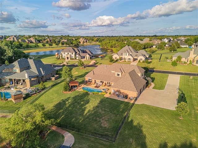 aerial view with a water view and a residential view