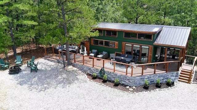 161720 N 4335th Rd, Clayton, OK 74536 - back of house featuring a deck, metal roof, an outdoor fire pit, and stairway