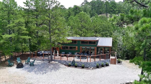 161720 N 4335th Rd, Clayton, OK 74536 - back of property featuring metal roof, stairway, and a view of trees