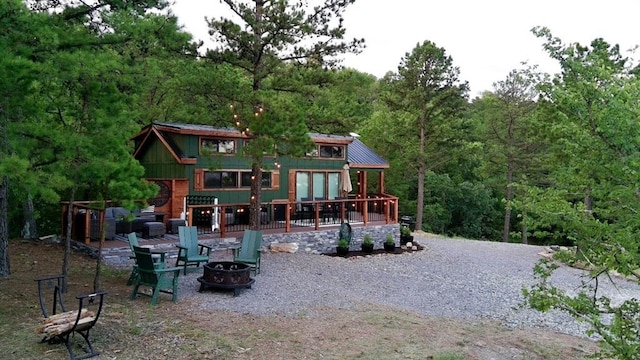 161720 N 4335th Rd, Clayton, OK 74536 - back of property featuring metal roof and an outdoor fire pit