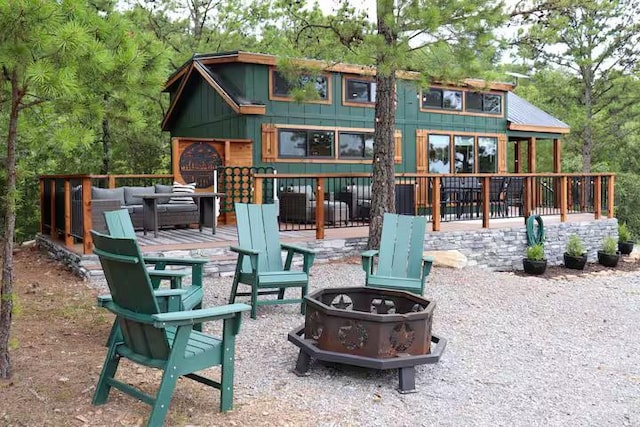 161720 N 4335th Rd, Clayton, OK 74536 - back of property with an outdoor living space with a fire pit