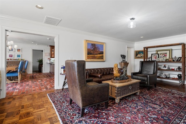 living room with a notable chandelier, visible vents, recessed lighting, and ornamental molding