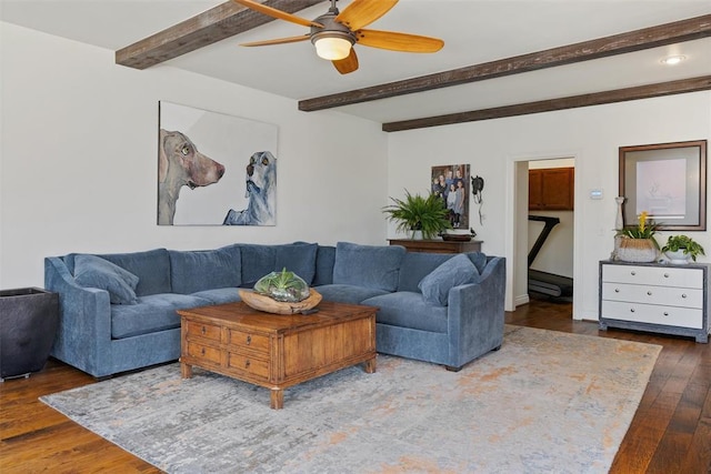 living room featuring beam ceiling, wood-type flooring, and a ceiling fan