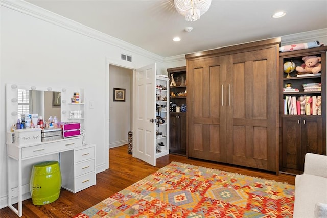 bedroom featuring visible vents, dark wood-type flooring, ornamental molding, recessed lighting, and baseboards