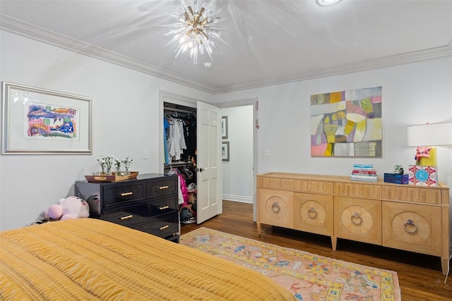 bedroom with crown molding and wood finished floors