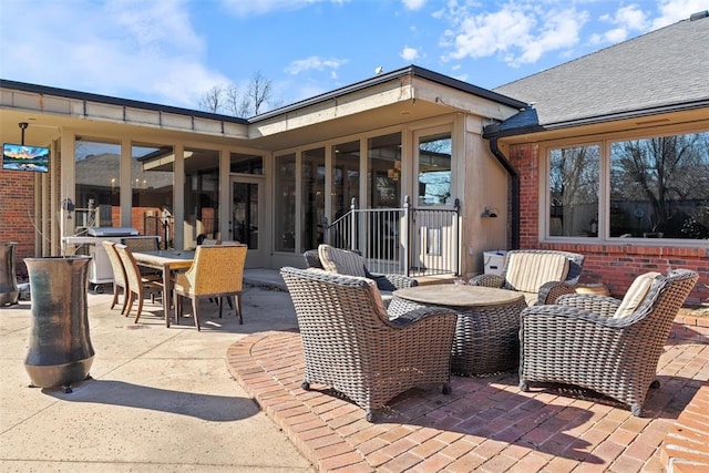 view of patio / terrace with an outdoor living space, area for grilling, and outdoor dining space