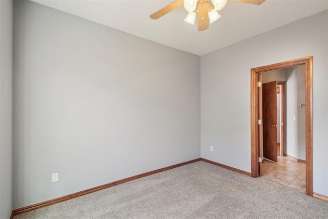 unfurnished room with light carpet, ceiling fan, and baseboards