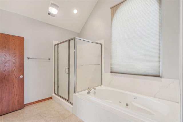 bathroom with vaulted ceiling, a tub with jets, a stall shower, and baseboards