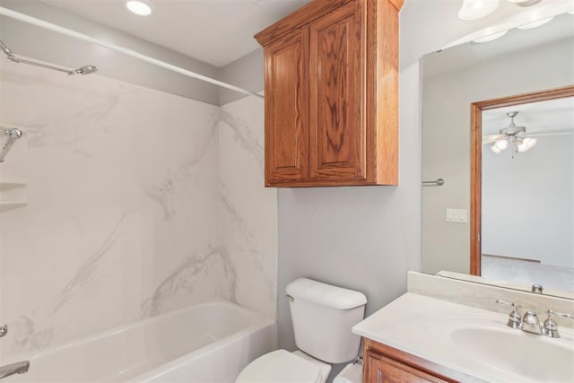 bathroom featuring toilet, shower / tub combination, and vanity