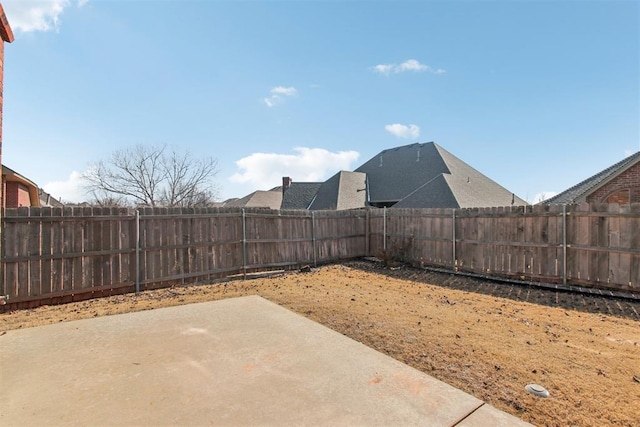 view of yard with a patio area and a fenced backyard