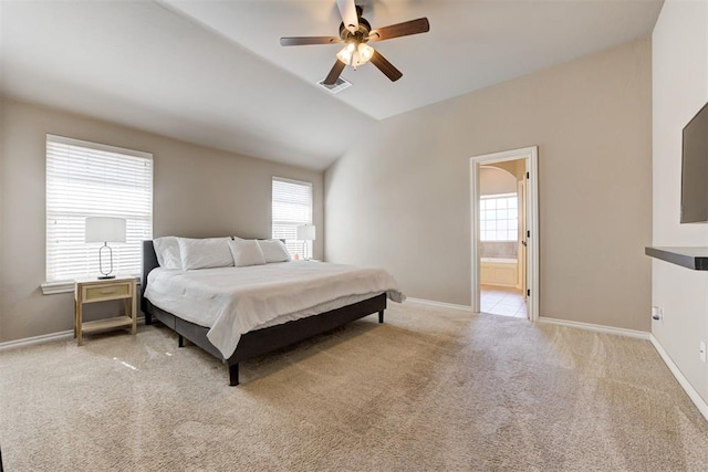 bedroom with carpet floors, lofted ceiling, and baseboards