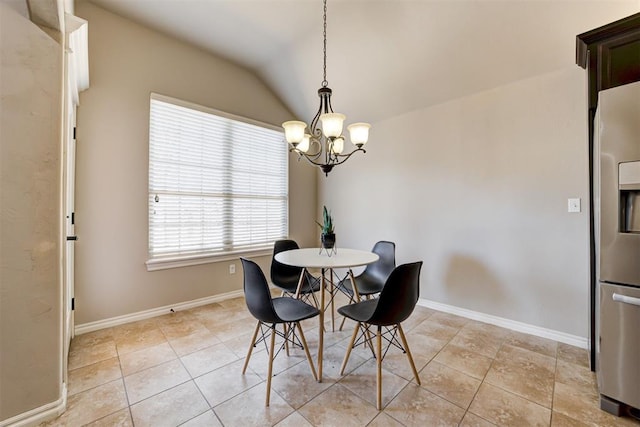 dining room with light tile patterned floors, baseboards, vaulted ceiling, and a notable chandelier