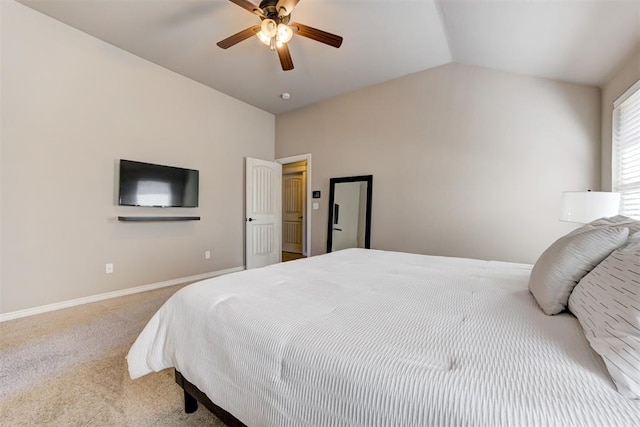 bedroom with vaulted ceiling, ceiling fan, carpet, and baseboards