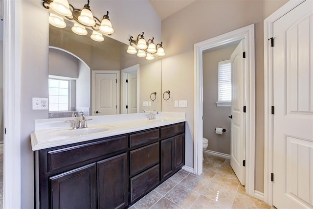 full bath featuring a wealth of natural light, a sink, and toilet