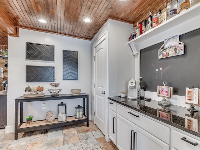 interior space with wooden ceiling, stone tile floors, recessed lighting, and crown molding