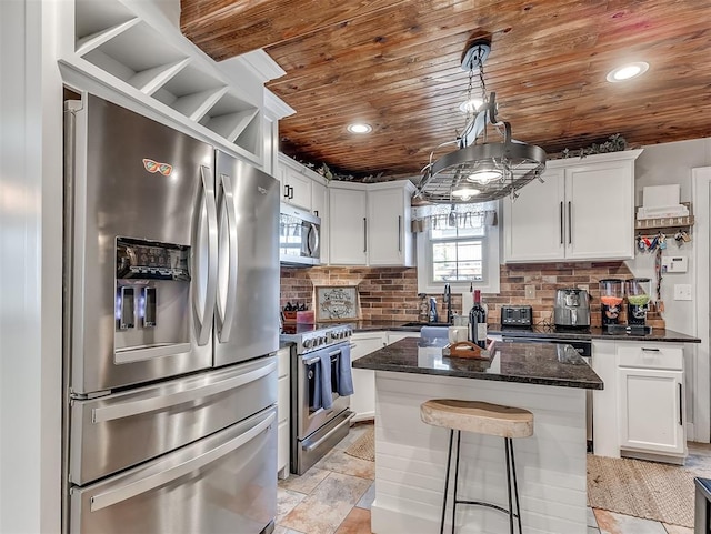 kitchen featuring recessed lighting, white cabinets, wood ceiling, appliances with stainless steel finishes, and backsplash